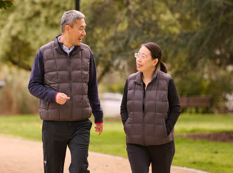 A Chinese man and woman walking
